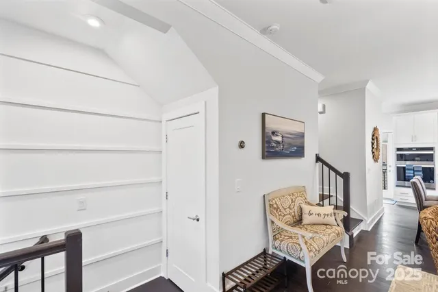 a living room with furniture a rug and a window