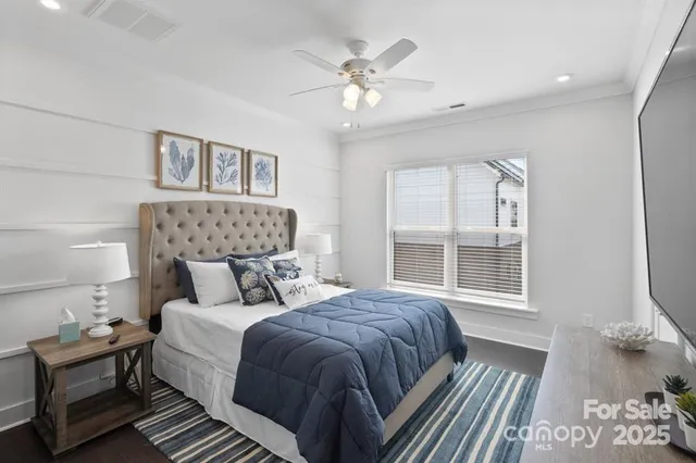 a bedroom with a large bed and a window