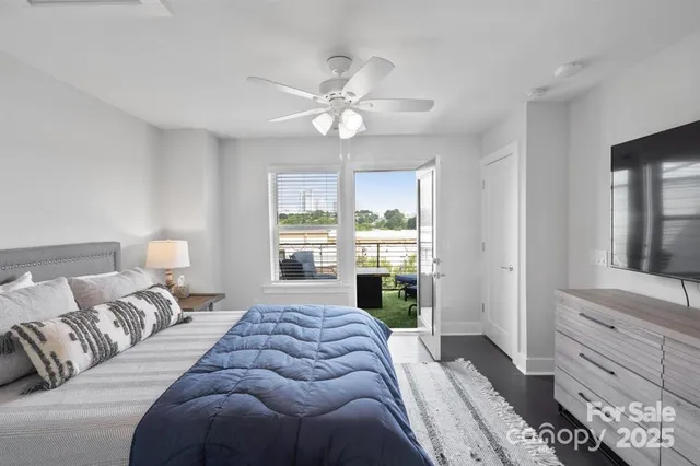 a bedroom with a large bed and a window