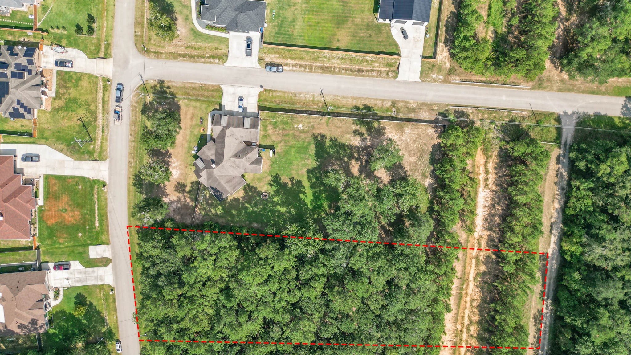 27542 Rio Blanco Drive Splendora, TX 77372 - Photo 11 of 19 a view of a lake with a building in the background