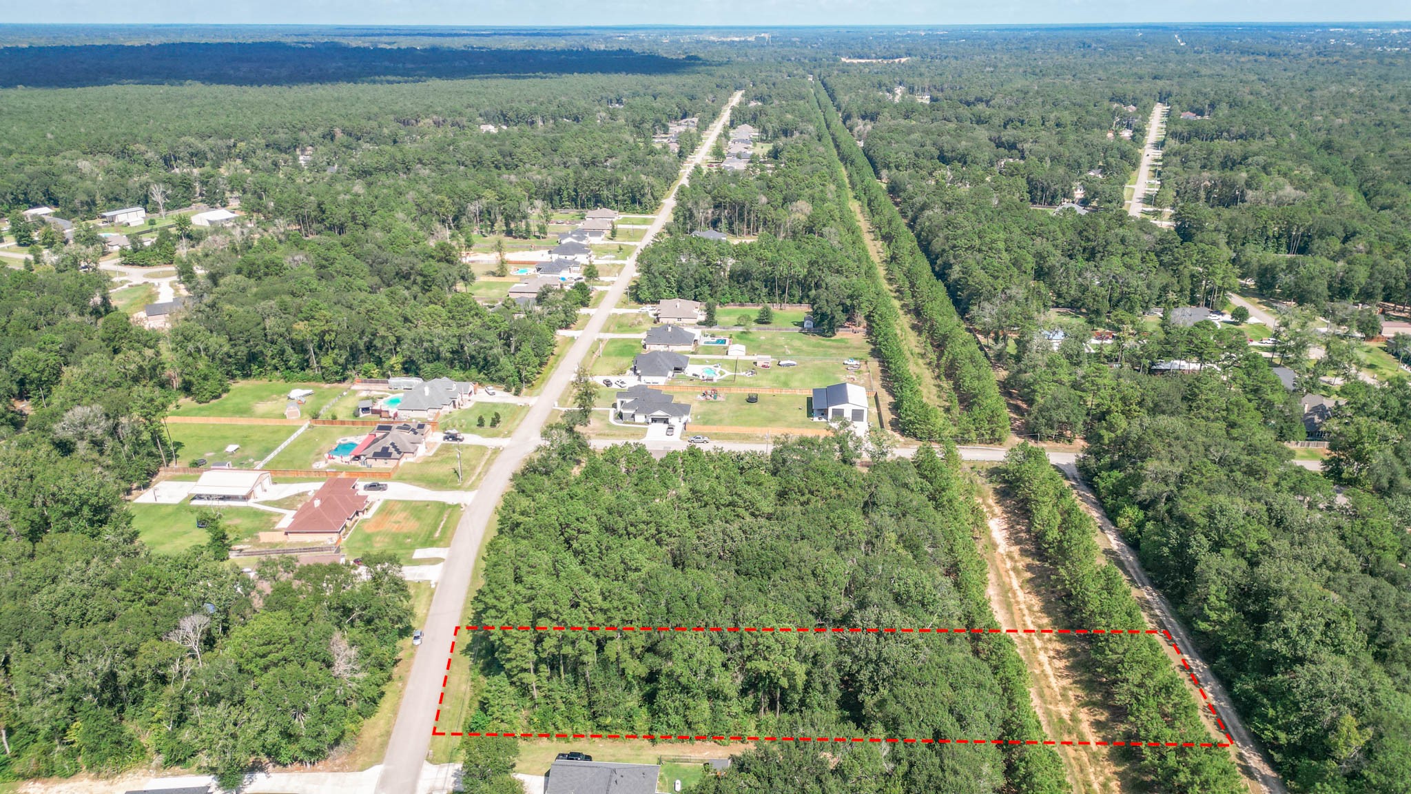 27542 Rio Blanco Drive Splendora, TX 77372 - Photo 3 of 19 an aerial view of residential houses with outdoor space and trees