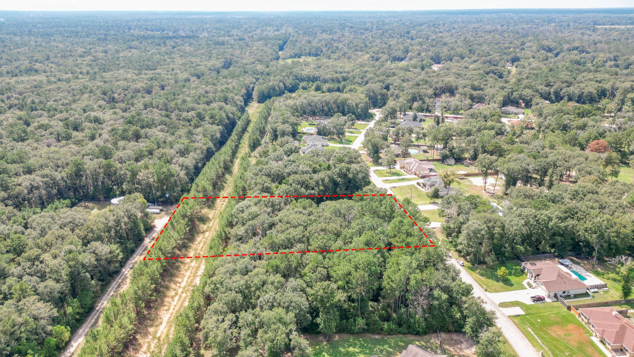 27542 Rio Blanco Drive Splendora, TX 77372 - Photo 7 of 19 an aerial view of residential houses with outdoor space