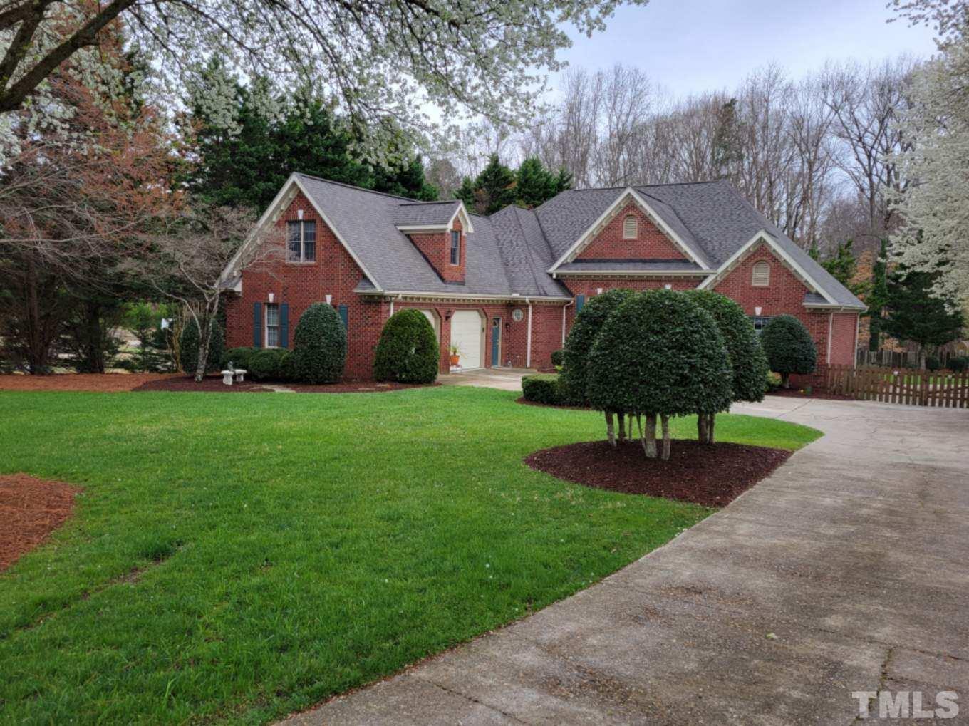 11201 Six Forks Road Raleigh, NC 27614 - Photo 4 of 70 a front view of a house with garden