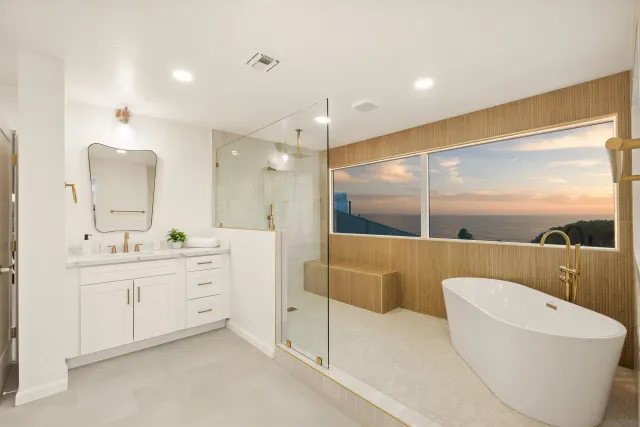 a bathroom with a bathtub and a shower