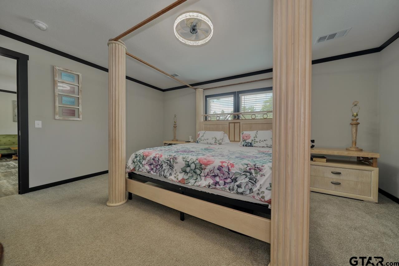 17675 Pine Drive Lindale, TX 75771 - Photo 17 of 35 a bedroom with a bed and a window