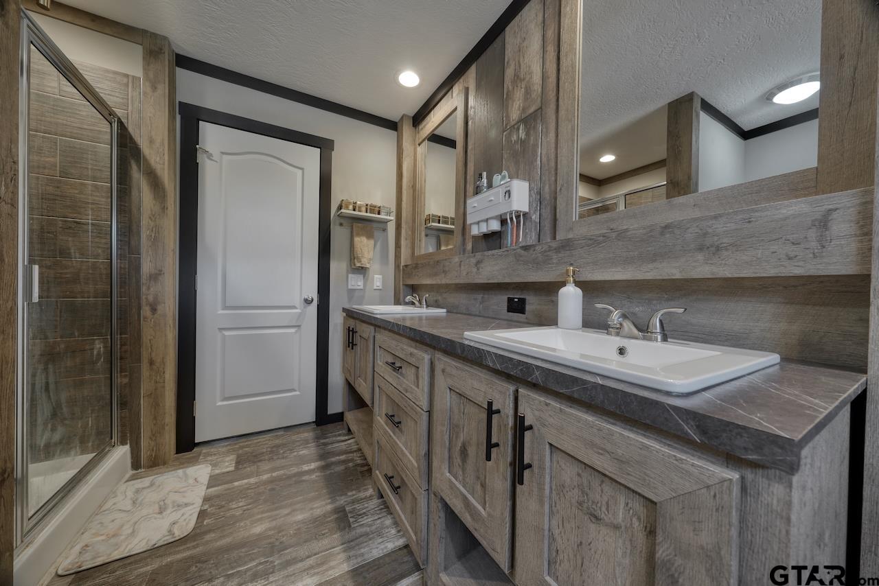 17675 Pine Drive Lindale, TX 75771 - Photo 21 of 35 a kitchen with sink and refrigerator