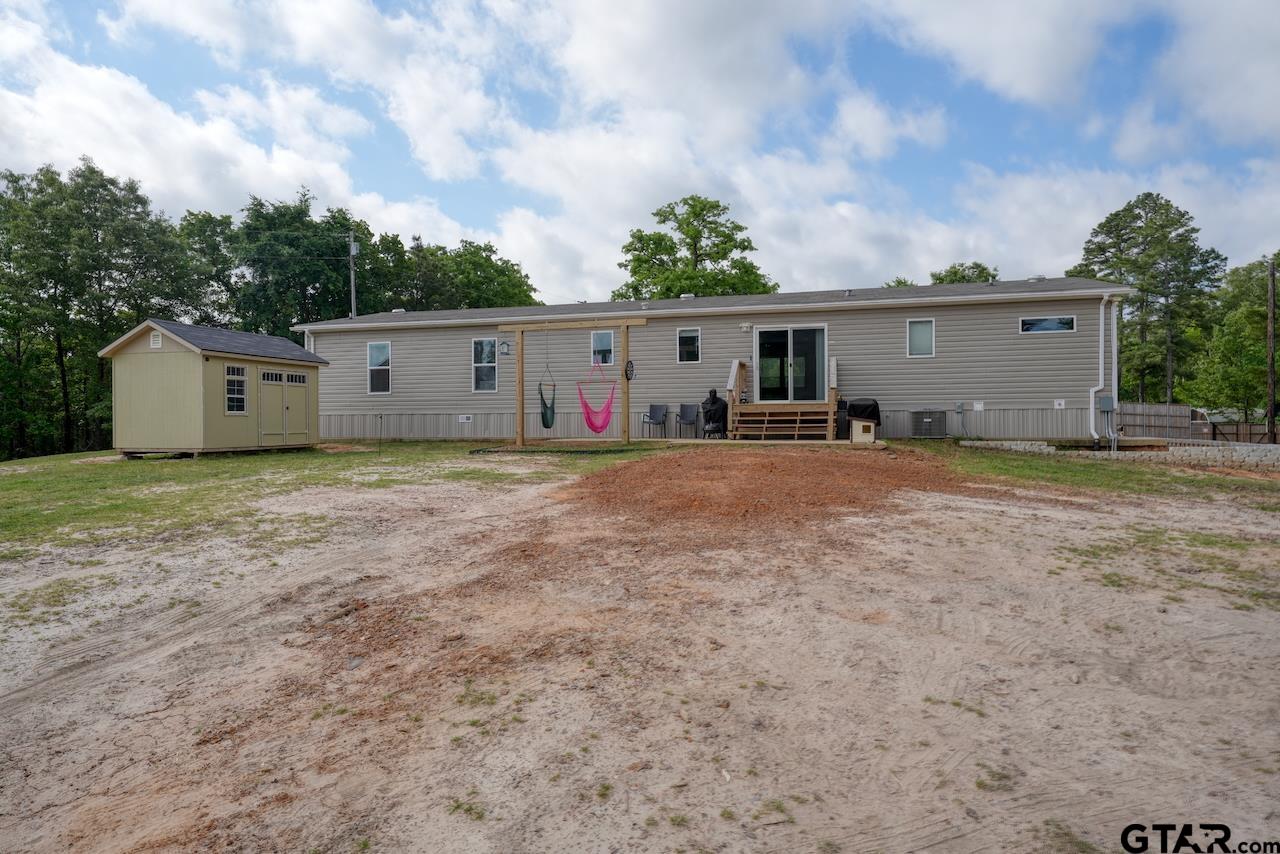 17675 Pine Drive Lindale, TX 75771 - Photo 35 of 35 a view of a house with backyard and trees
