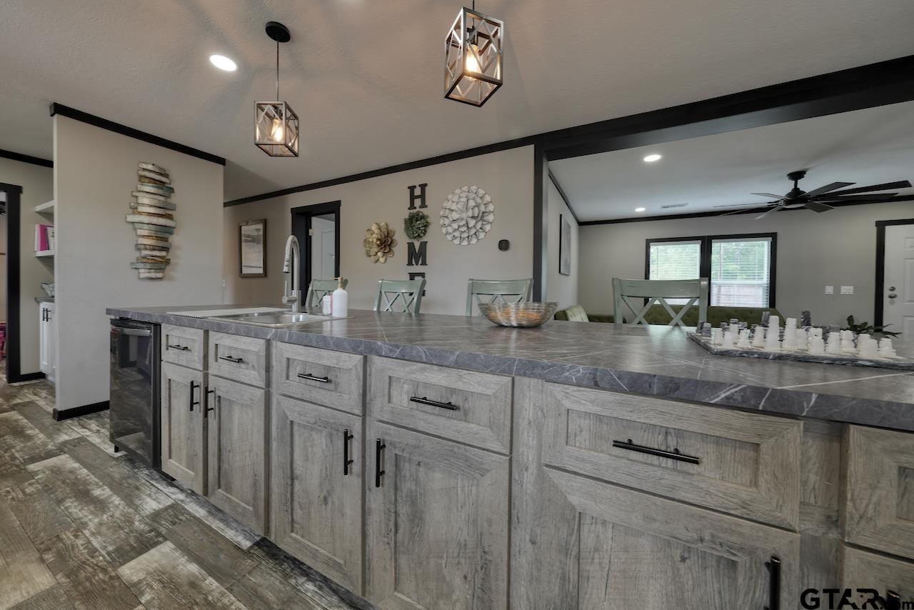17675 Pine Drive Lindale, TX 75771 - Photo 9 of 35 a bathroom with a granite countertop double vanity sink and a mirror