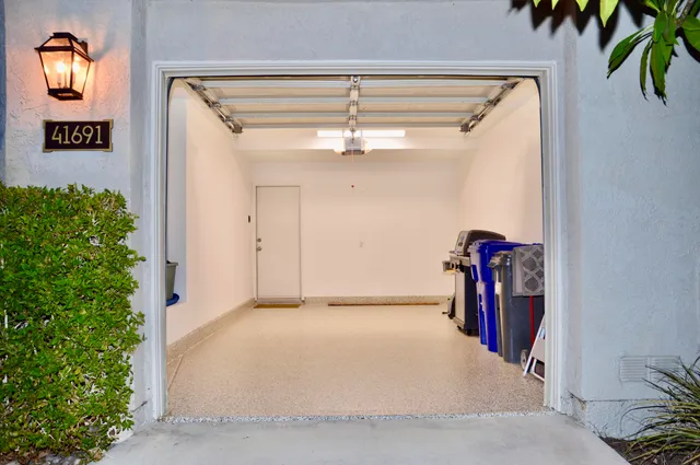a view of a hallway with closet and a potted plant