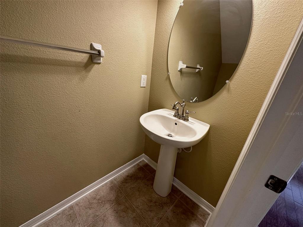 11801 Essington Street New Port Richey, FL 34654 - Photo 19 of 79 a bathroom with a sink and mirror