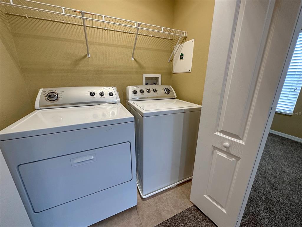11801 Essington Street New Port Richey, FL 34654 - Photo 25 of 79 a utility room with dryer and washer