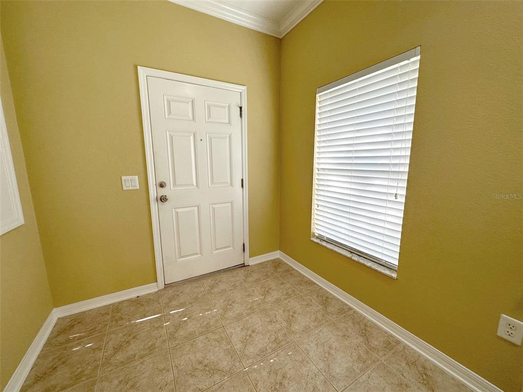11801 Essington Street New Port Richey, FL 34654 - Photo 3 of 79 a view of an empty room with a window