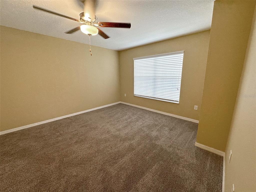 11801 Essington Street New Port Richey, FL 34654 - Photo 39 of 79 a view of an empty room with a window