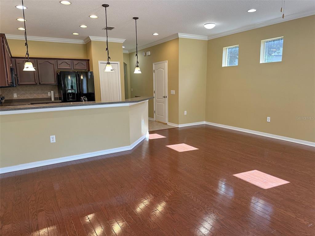 11801 Essington Street New Port Richey, FL 34654 - Photo 4 of 79 a view of kitchen with refrigerator and window