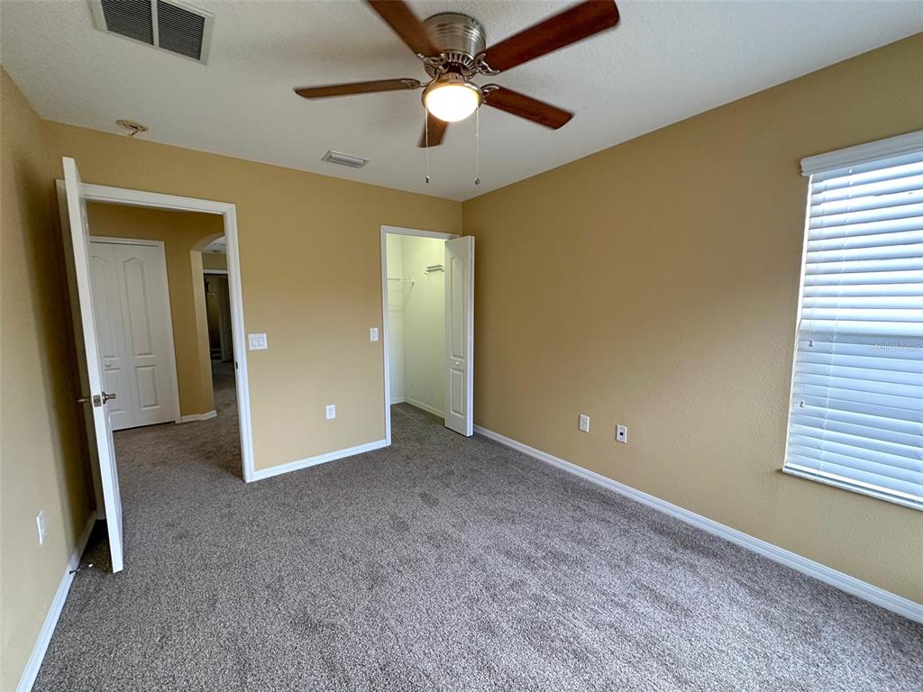 11801 Essington Street New Port Richey, FL 34654 - Photo 42 of 79 wooden floor in an empty room with a window