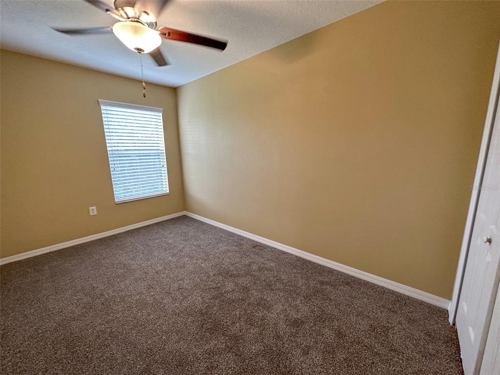 11801 Essington Street New Port Richey, FL 34654 - Photo 43 of 79 a view of an empty room with a window