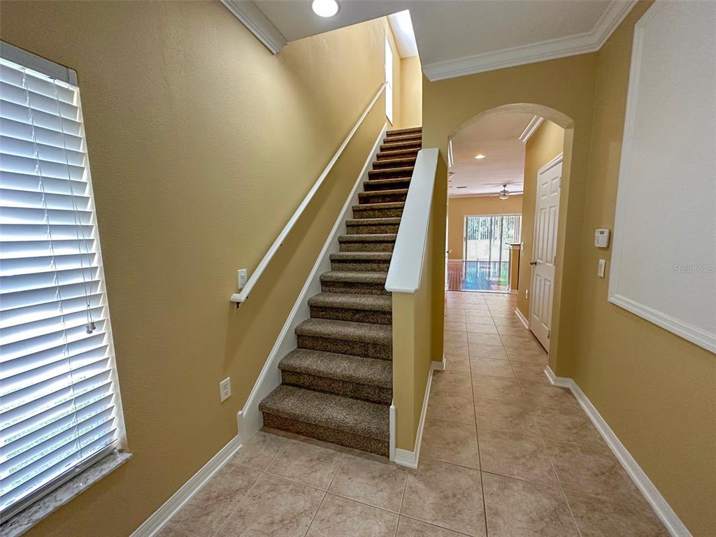 11801 Essington Street New Port Richey, FL 34654 - Photo 53 of 79 a view of entryway and hall with wooden floor