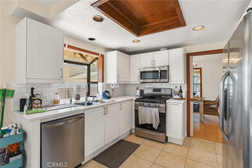 14 Thunder Trail, Unit 28 Irvine, CA 92614 - Photo 13 of 60 a kitchen with a sink stove and refrigerator