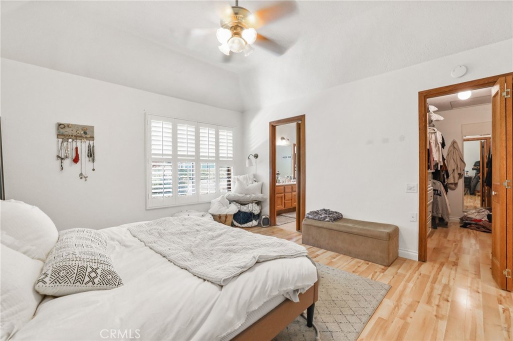 14 Thunder Trail, Unit 28 Irvine, CA 92614 - Photo 25 of 60 a spacious bedroom with a bed and a chandelier