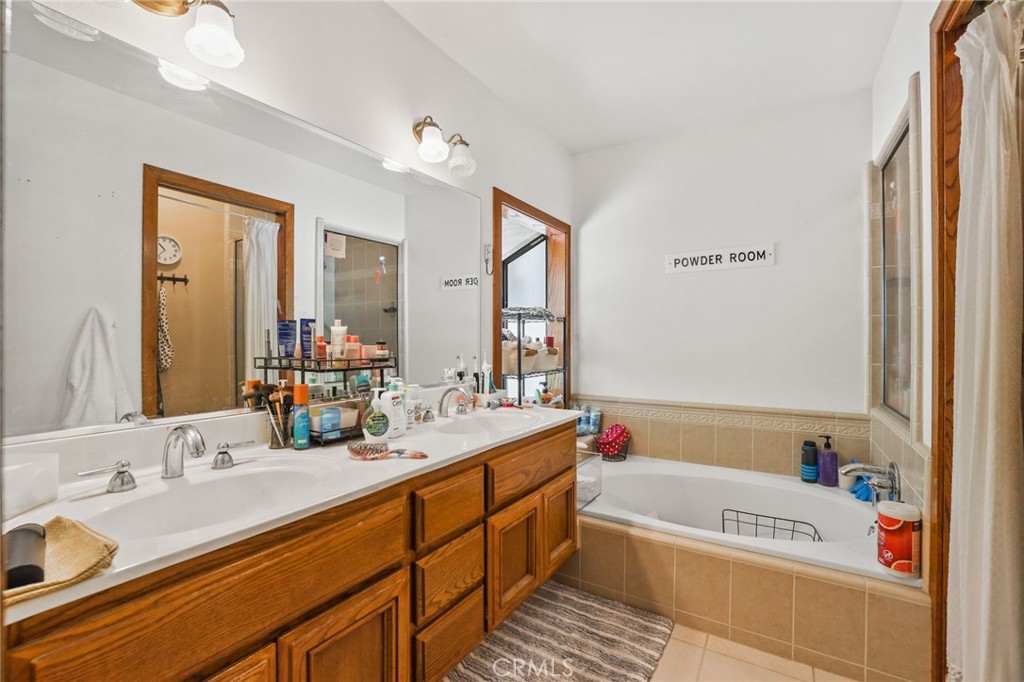 14 Thunder Trail, Unit 28 Irvine, CA 92614 - Photo 27 of 60 a bathroom with a tub a sink double vanity and a mirror