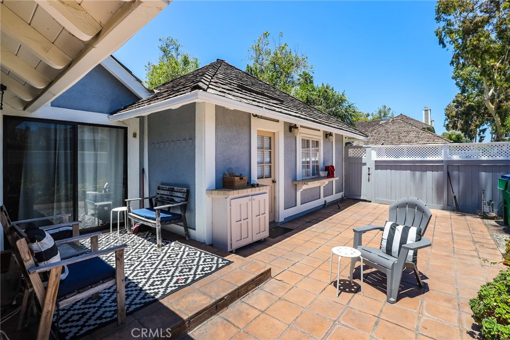 14 Thunder Trail, Unit 28 Irvine, CA 92614 - Photo 30 of 60 a view of backyard with outdoor seating and wooden fence