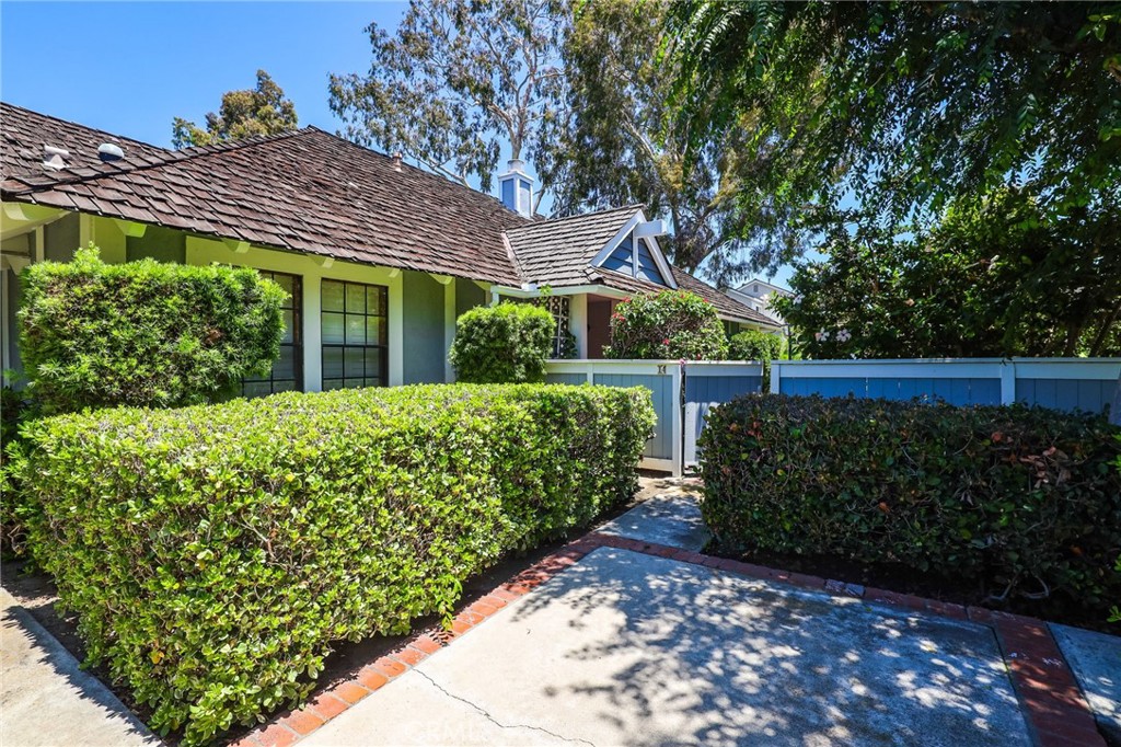 14 Thunder Trail, Unit 28 Irvine, CA 92614 - Photo 3 of 60 a view of a house with a big yard potted plants