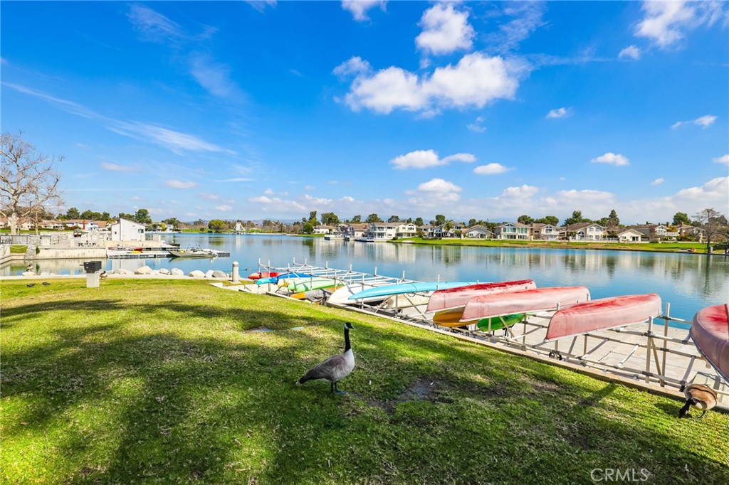 14 Thunder Trail, Unit 28 Irvine, CA 92614 - Photo 44 of 60 a view of a lake with houses in the back