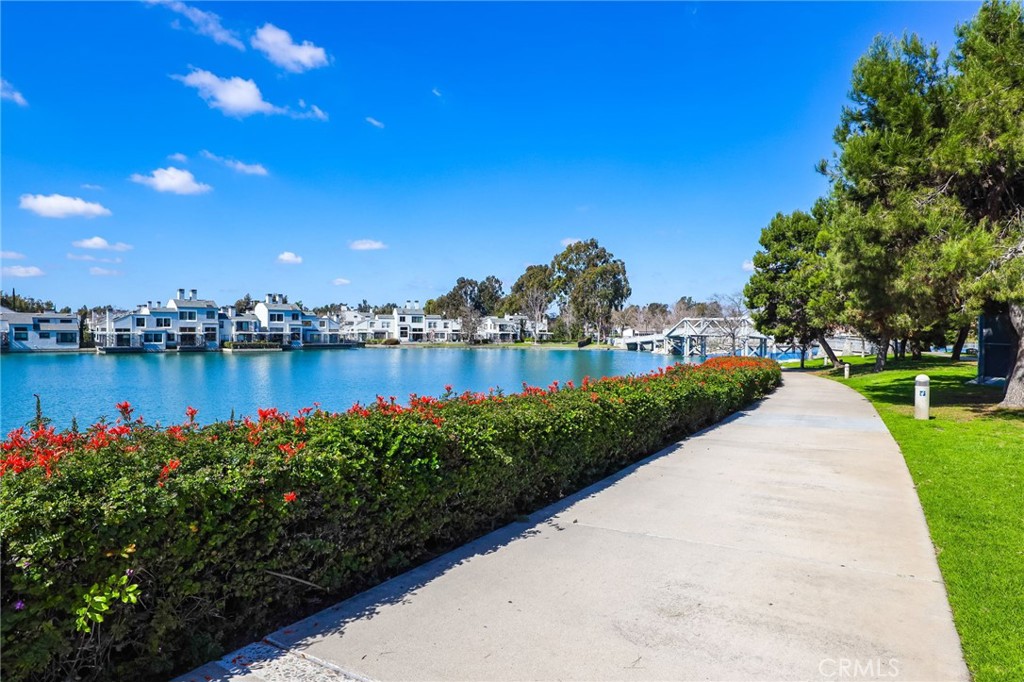 14 Thunder Trail, Unit 28 Irvine, CA 92614 - Photo 47 of 60 a view of a lake with a house in the background