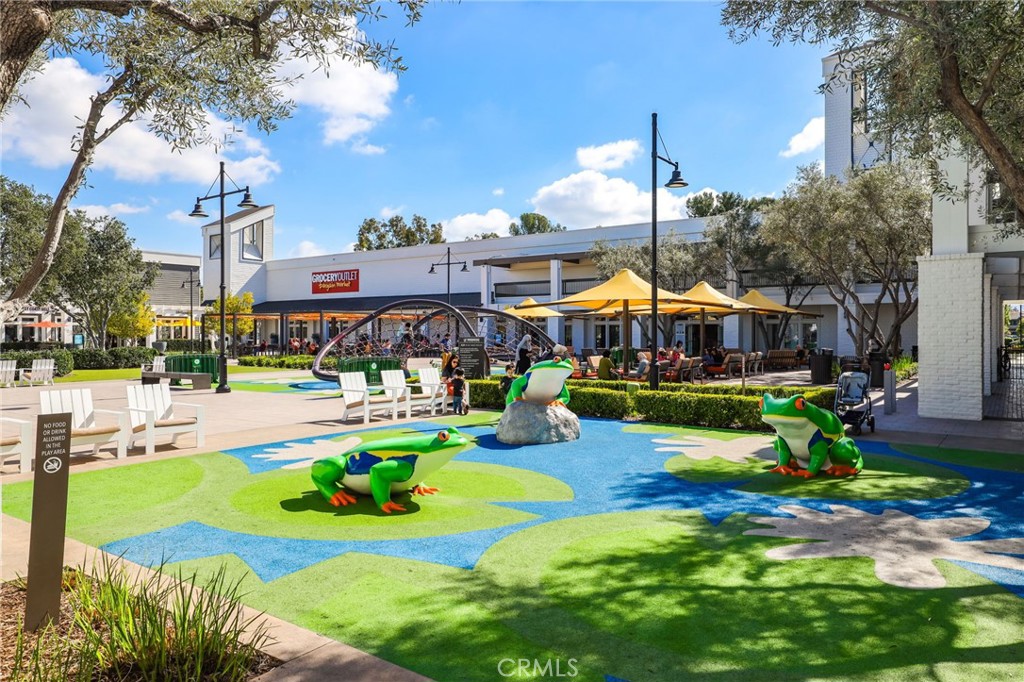 14 Thunder Trail, Unit 28 Irvine, CA 92614 - Photo 57 of 60 a view of a swimming pool with lawn chairs and a yard