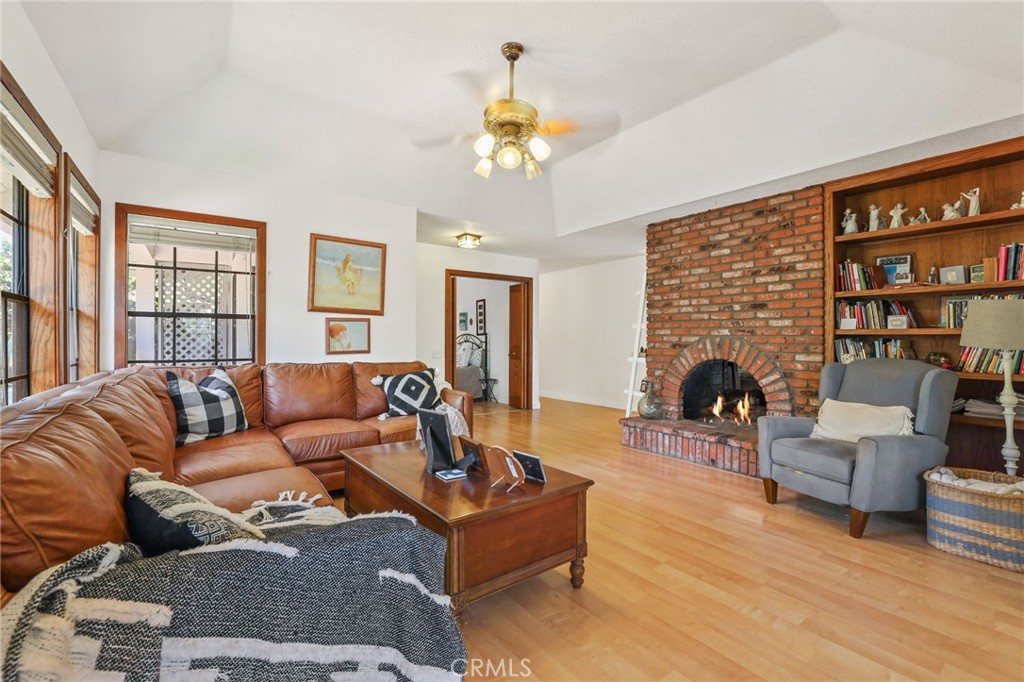 14 Thunder Trail, Unit 28 Irvine, CA 92614 - Photo 9 of 60 a living room with furniture a chandelier and a fireplace