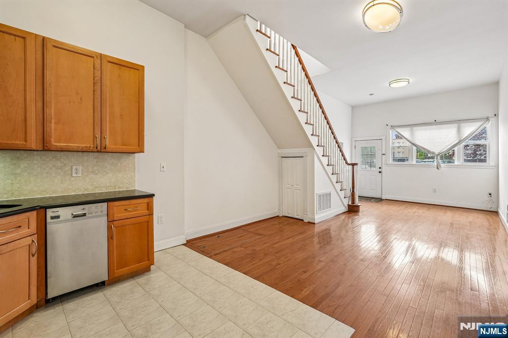 90 A Hackensack Plank Road Weehawken, NJ 07086 - Photo 16 of 40 a view of a kitchen with wooden floor and staircase