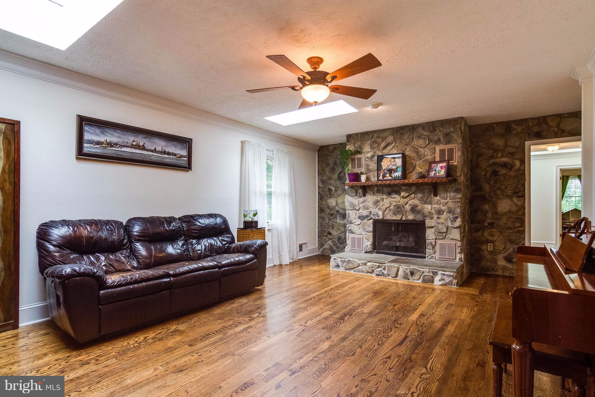 18348 Sharon Road Triangle, VA 22172 - Photo 10 of 30 Living room with stone gas fireplace