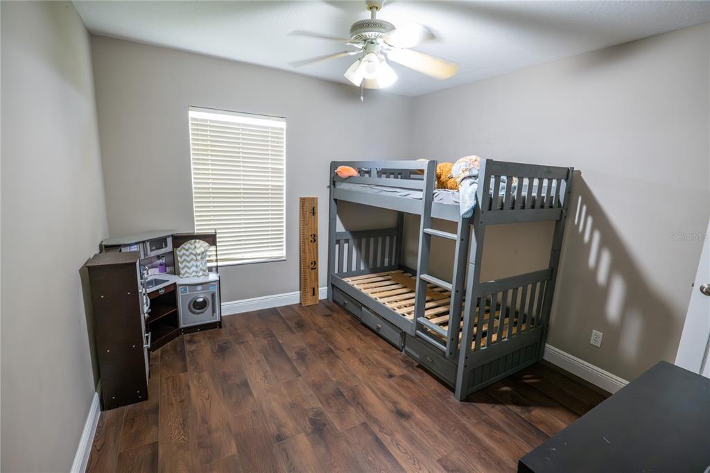 852 North Jacks Lake Road Clermont, FL 34711 - Photo 20 of 29 a bedroom with furniture and a window