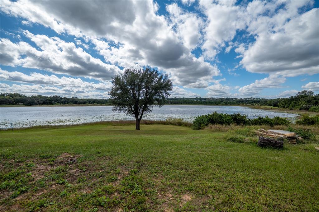 852 North Jacks Lake Road Clermont, FL 34711 - Photo 27 of 29 a view of a lake with a big yard