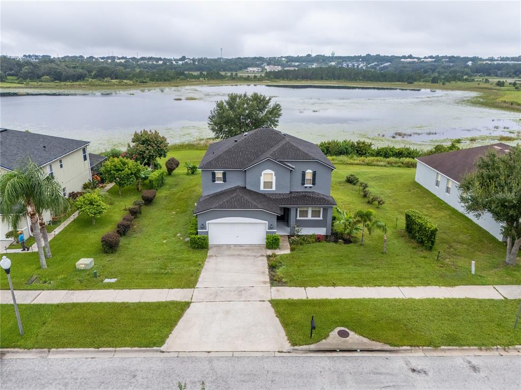 852 North Jacks Lake Road Clermont, FL 34711 - Photo 3 of 29 a front view of a house with a lake view