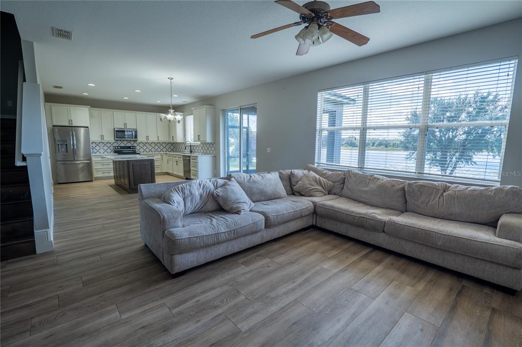 852 North Jacks Lake Road Clermont, FL 34711 - Photo 6 of 29 a living room with furniture and a large window