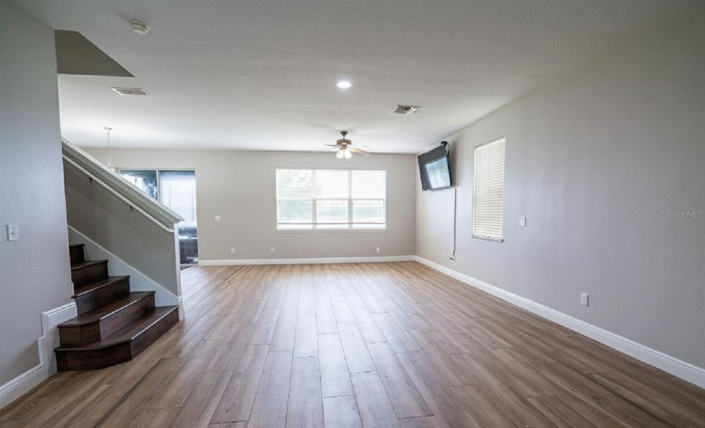 852 North Jacks Lake Road Clermont, FL 34711 - Photo 7 of 29 wooden floor in an empty room with a window
