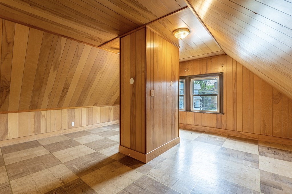 85 Naples Road Brookline, MA 02446 - Photo 17 of 19 a view of an entryway with wooden floor and door