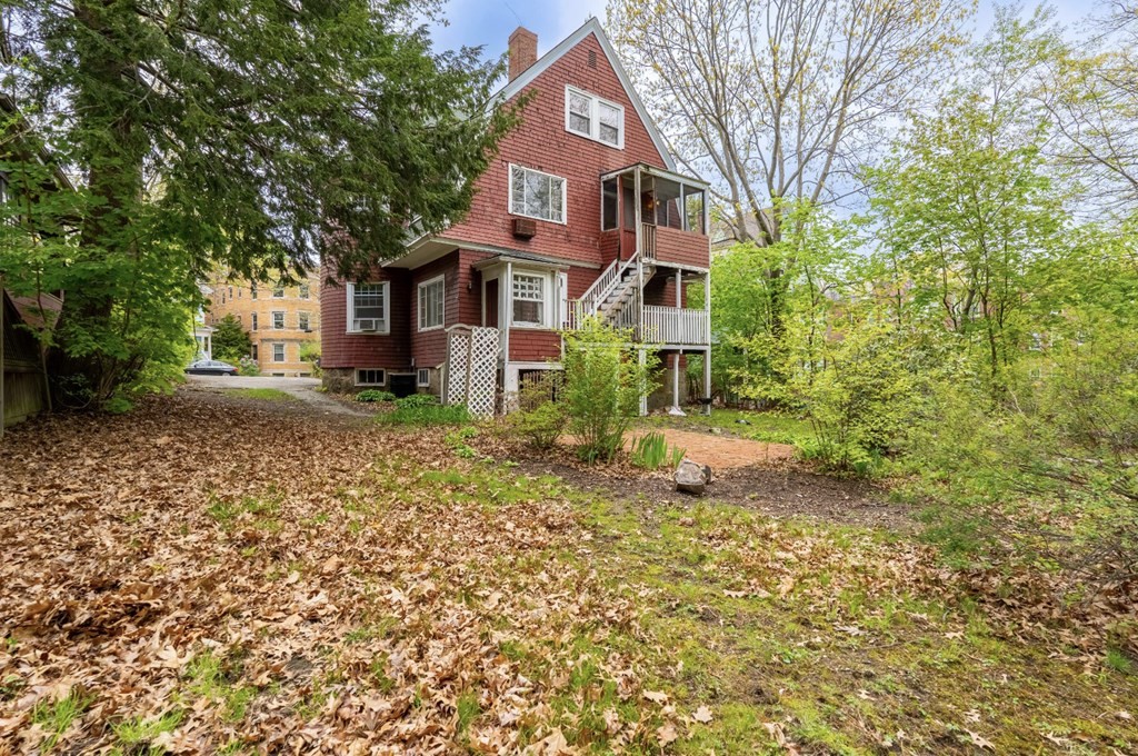 85 Naples Road Brookline, MA 02446 - Photo 3 of 19 a front view of a house with a yard and large trees