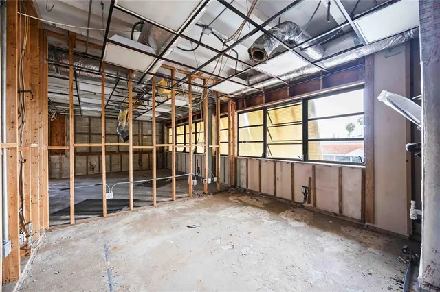a view of an empty room with a balcony