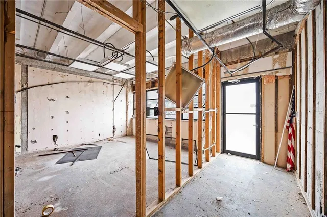 a view of a house with wooden fence