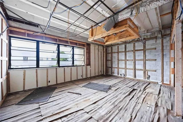 a view of a porch with wooden floor and fence
