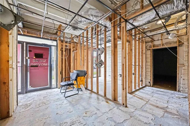 a view of a porch with furniture and a gate
