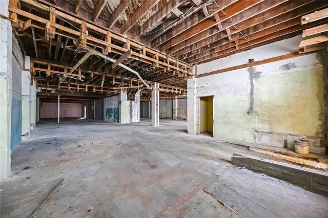 a view of a room with wooden walls
