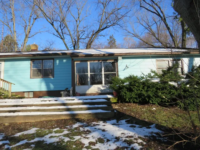 a view of street with large trees