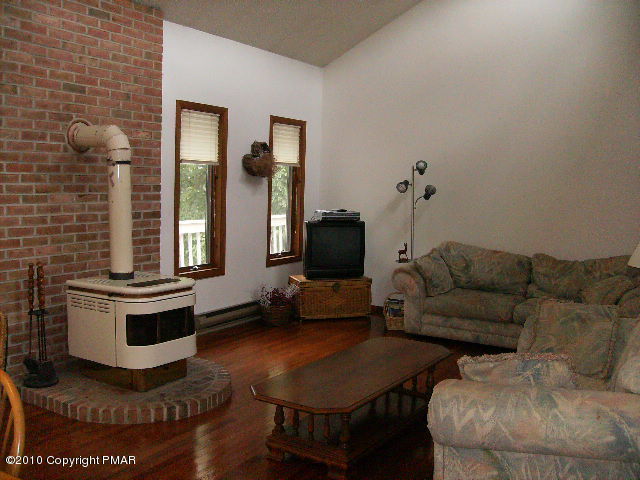 826 Hampstead Road Bushkill, PA 18324 - Photo 4 of 18 a living room with furniture and a flat screen tv