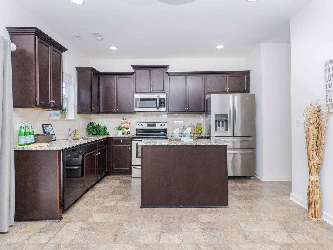 3613 Marble Ridge Lane Raleigh, NC 27610 - Photo 2 of 9 This kitchen has it all; granite counters, SS appliances and beautiful backsplash. Kitchen