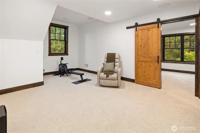 a view of room with workspace and windows