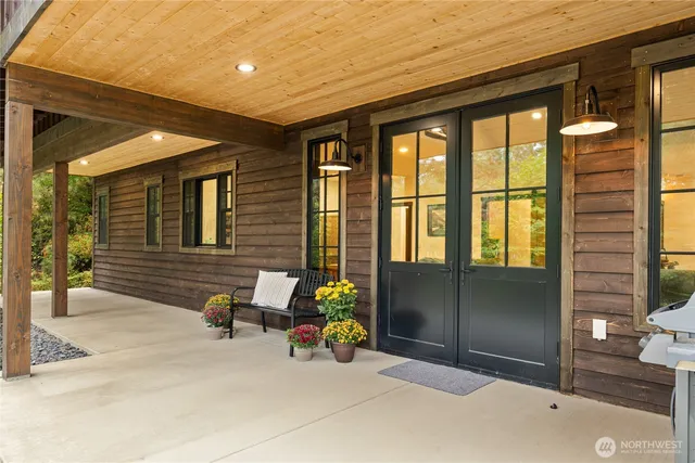 an aerial view of a house with yard and outdoor seating