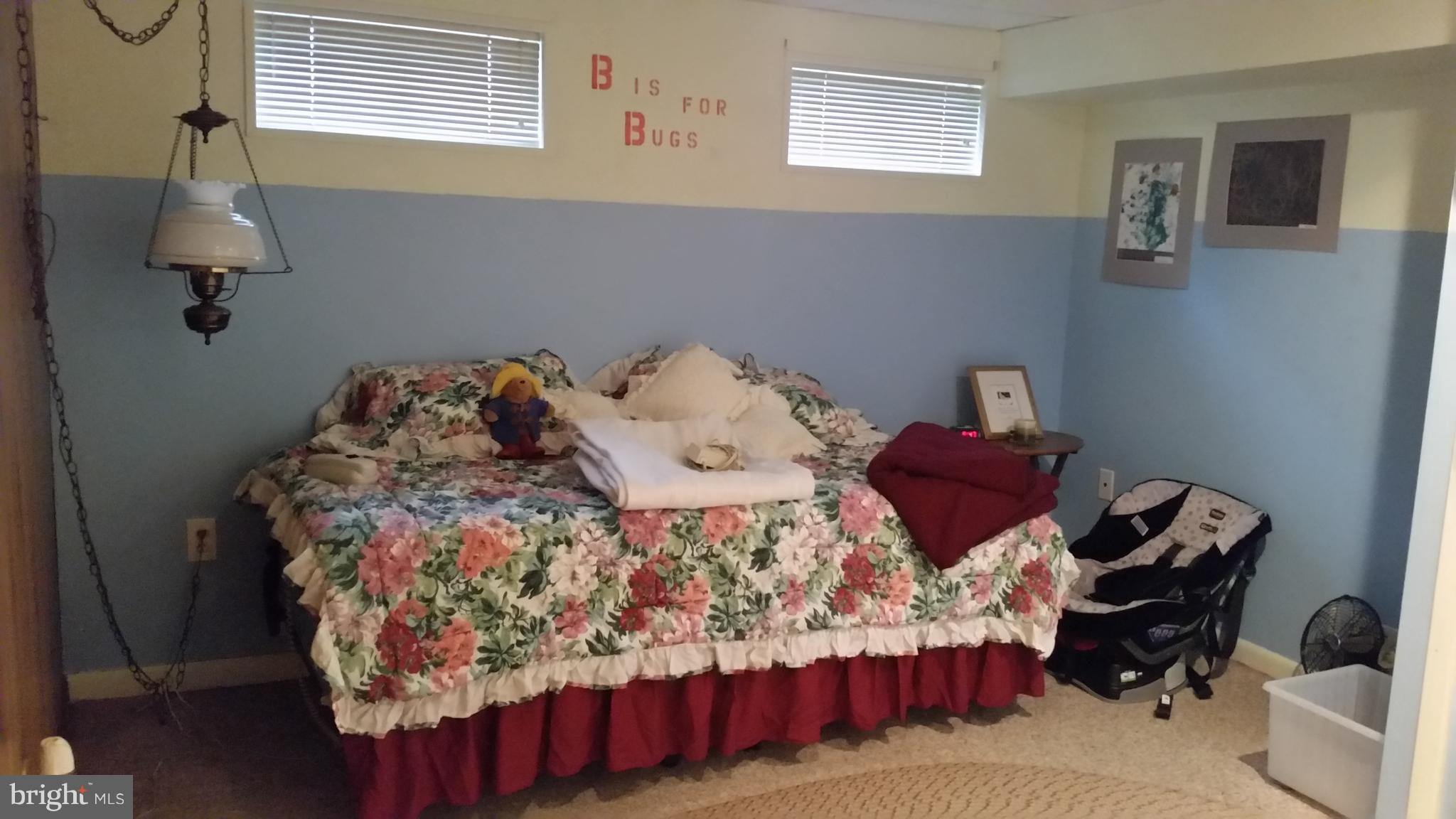 1305 4th Road Baltimore, MD 21220 - Photo 16 of 24 a bedroom with a bed and a window